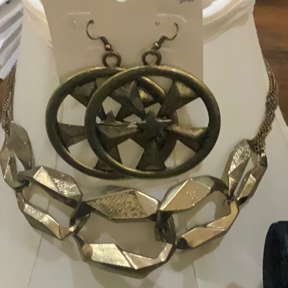 Gold Oval Earrings with Intricate Cutout Design